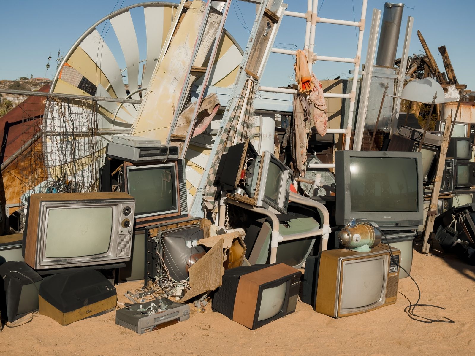 A stack of old television sets waiting for recycling
