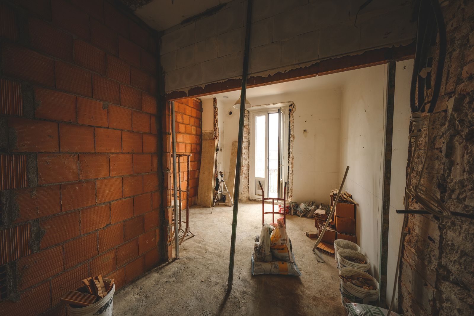 A room stripped back to bare structure during a tear-out